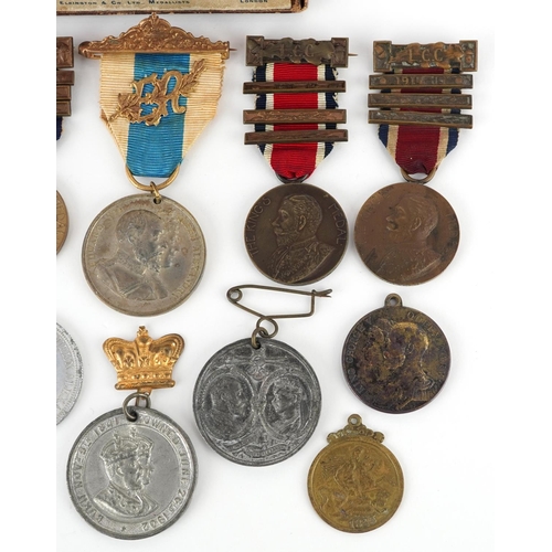 2433 - A collection of commemorative medallions and awards including The King's Medals for Attendance award... 