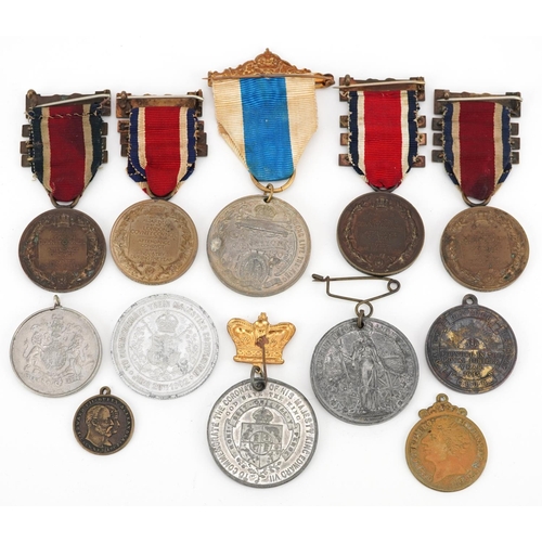 2433 - A collection of commemorative medallions and awards including The King's Medals for Attendance award... 