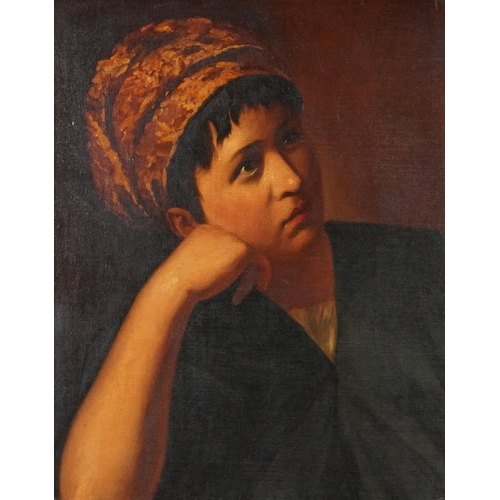 A half length portrait of a girl, late 19th/early 20th century British school oil on canvas within a gilt moulded and stiff leaf frame, bearing framer's label to the reverse, 49cm x 39cm.