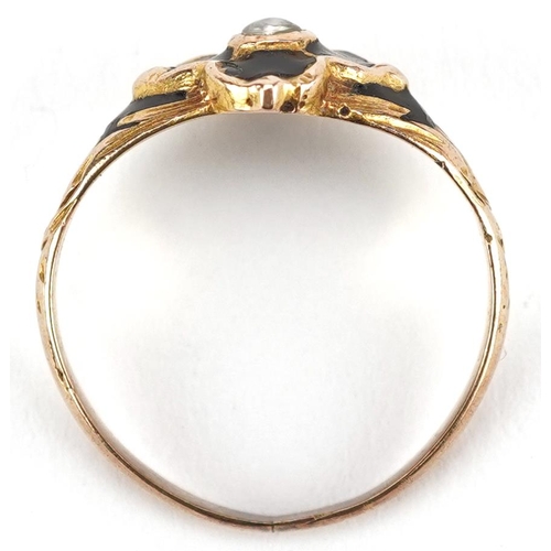 3034 - An antique unmarked gold black enamel and seed pearl mourning ring, size I/J, 2.1g.