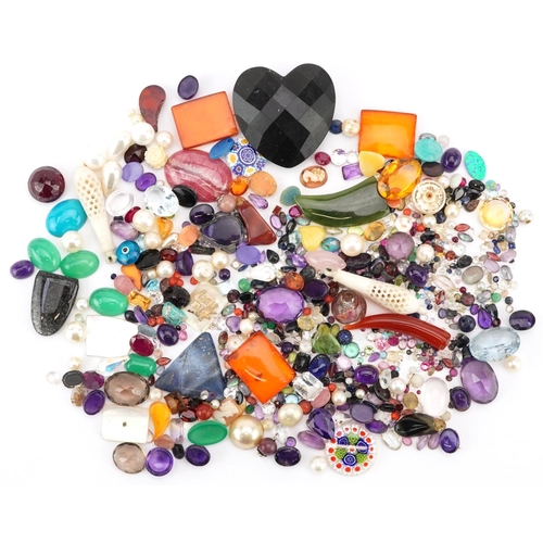 3326 - A large collection of loose semi precious stones and beads including amethyst, citrine, jade, turquo... 