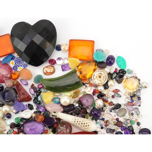 3326 - A large collection of loose semi precious stones and beads including amethyst, citrine, jade, turquo... 