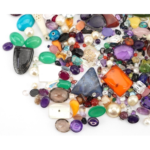 3326 - A large collection of loose semi precious stones and beads including amethyst, citrine, jade, turquo... 