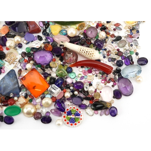 3326 - A large collection of loose semi precious stones and beads including amethyst, citrine, jade, turquo... 