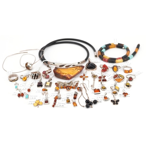 3315 - A large collection of silver mounted amber jewellery, predominantly with Natural Wonders labels incl... 