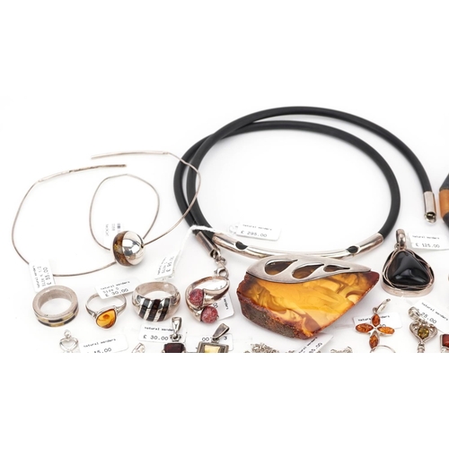 3315 - A large collection of silver mounted amber jewellery, predominantly with Natural Wonders labels incl... 