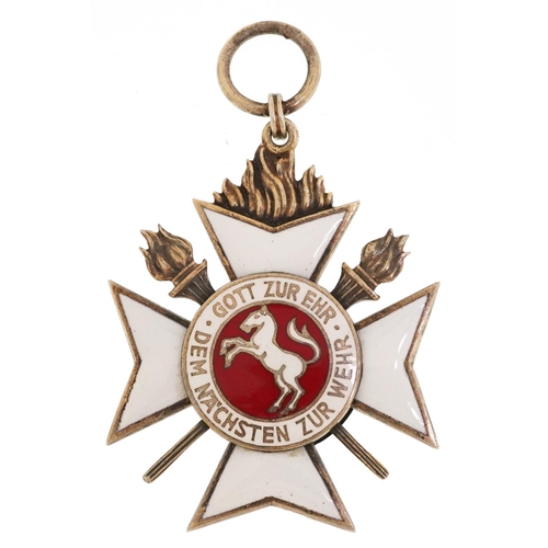 2553 - A German military interest white and red enamel medal for Outstanding Services in Fire Extinguishing... 