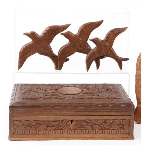 1518 - A group of late 20th century Indian carved softwood items including a pair of oval frames, a cigar b... 