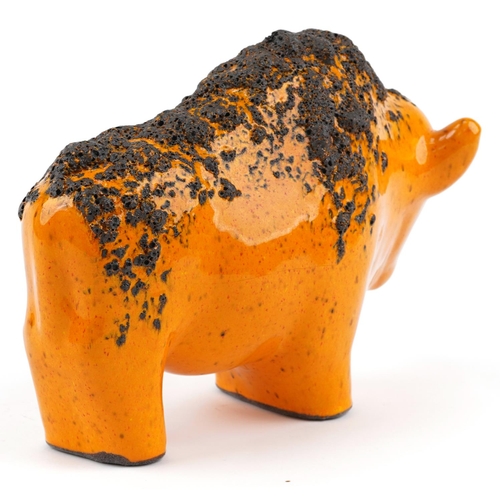 23 - An Otto Keramik, West German pottery bull, model number 1012, finished in an orange fat lava glaze, ... 