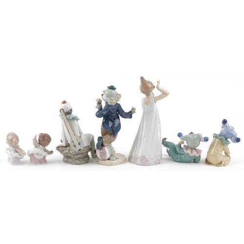 1221 - Seven Nao porcelain figures including three clowns, a Pierrot and a young girl with hand mirror, thr... 