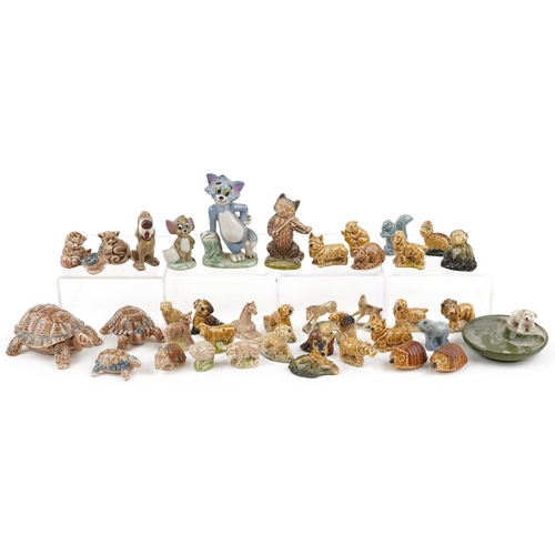 1235 - A collection of Wade Whimsies and Disney figures including Tom & Jerry, the largest 9cm high.