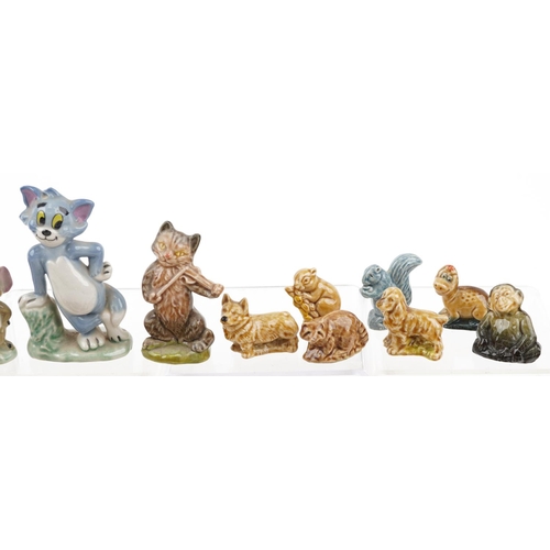 1235 - A collection of Wade Whimsies and Disney figures including Tom & Jerry, the largest 9cm high.