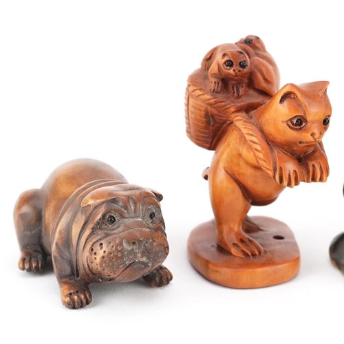 105 - Five Japanese carved wood netsukes including a lizard on a leaf, frog and Bulldog, the largest 6cm i... 