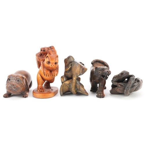 105 - Five Japanese carved wood netsukes including a lizard on a leaf, frog and Bulldog, the largest 6cm i... 