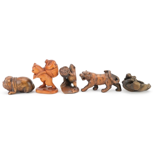 105 - Five Japanese carved wood netsukes including a lizard on a leaf, frog and Bulldog, the largest 6cm i... 