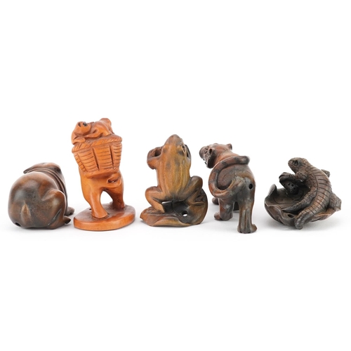 105 - Five Japanese carved wood netsukes including a lizard on a leaf, frog and Bulldog, the largest 6cm i... 