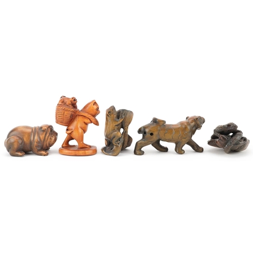 105 - Five Japanese carved wood netsukes including a lizard on a leaf, frog and Bulldog, the largest 6cm i... 