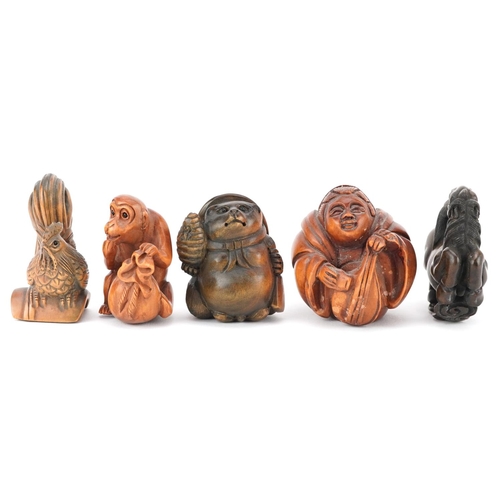 106 - Five Japanese carved wood netsukes including cockerel, horse and monkey with fruit, the largest 5cm ... 