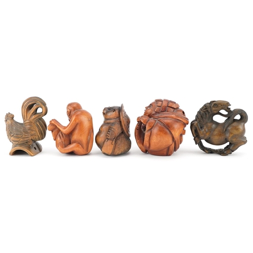 106 - Five Japanese carved wood netsukes including cockerel, horse and monkey with fruit, the largest 5cm ... 