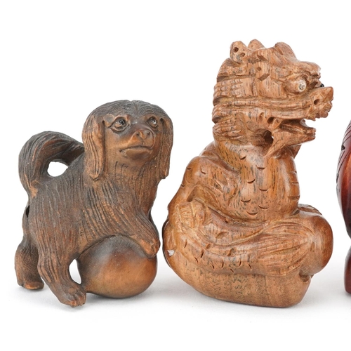 108 - Five Japanese carved wood netsukes including duck, dragon and owls, the largest 6cm high.