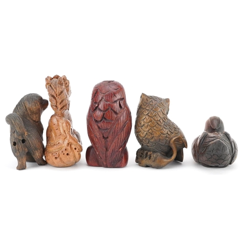 108 - Five Japanese carved wood netsukes including duck, dragon and owls, the largest 6cm high.