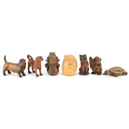 110 - Seven Japanese carved wood netsukes including mouse with corn, tortoise, toad and dogs, the largest ... 