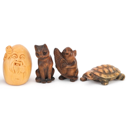 110 - Seven Japanese carved wood netsukes including mouse with corn, tortoise, toad and dogs, the largest ... 