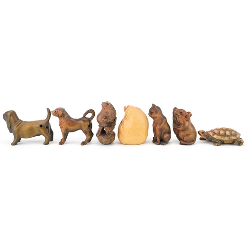 110 - Seven Japanese carved wood netsukes including mouse with corn, tortoise, toad and dogs, the largest ... 