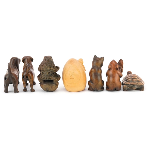 110 - Seven Japanese carved wood netsukes including mouse with corn, tortoise, toad and dogs, the largest ... 