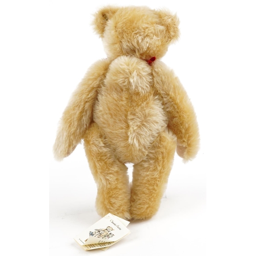 1299 - A Steiff 1909 Classic teddy bear with growler and articulated limbs numbered 00379 with a Steiff bag... 