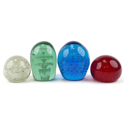 352 - Four colourful glass paperweights including a Victorian dump weight, the largest 11cm high.