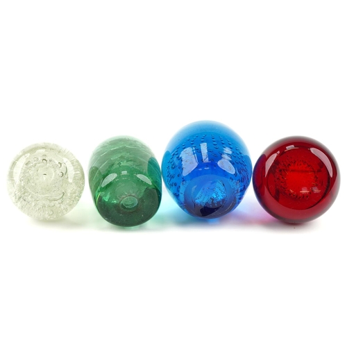 352 - Four colourful glass paperweights including a Victorian dump weight, the largest 11cm high.