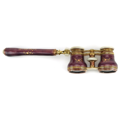  A good pair of French guilloche enamel, brass and mother of pearl opera glasses with telescopic hand... 