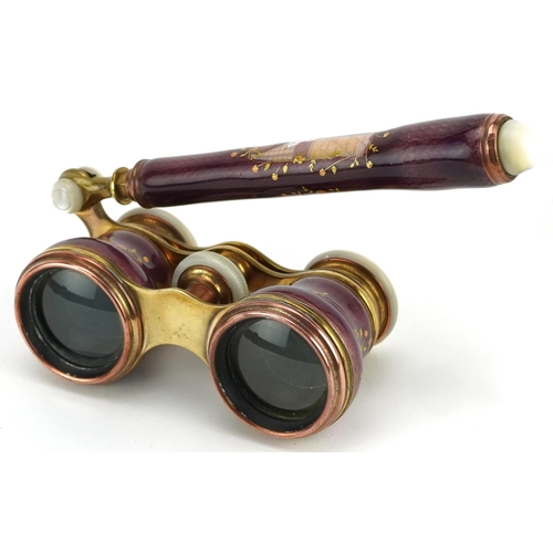  A good pair of French guilloche enamel, brass and mother of pearl opera glasses with telescopic hand... 