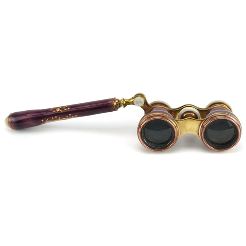  A good pair of French guilloche enamel, brass and mother of pearl opera glasses with telescopic hand... 