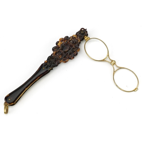 6 - A pair of Victorian tortoiseshell and gilt metal folding lorgnettes, 16cm in length.