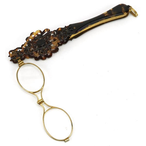 6 - A pair of Victorian tortoiseshell and gilt metal folding lorgnettes, 16cm in length.