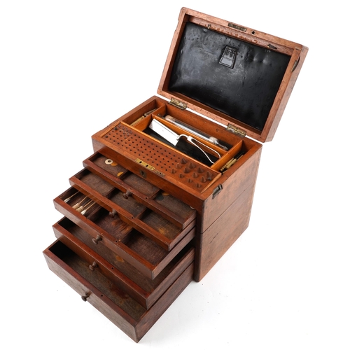 A Victorian mahogany dentist's box, the hinged lid revealing a compartmentalized interior above six drawers, 34cm H x 33cm W x 23cm D.