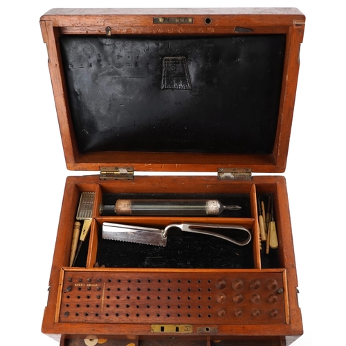 140 - A Victorian mahogany dentist's box, the hinged lid revealing a compartmentalized interior above six ... 