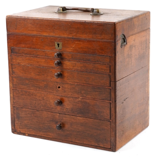 140 - A Victorian mahogany dentist's box, the hinged lid revealing a compartmentalized interior above six ... 