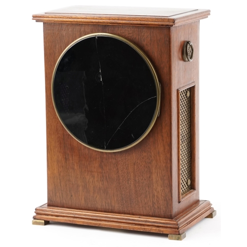  An Edwardian mahogany mantle clock with inlaid decoration, the white enamelled circular dial with Ro... 