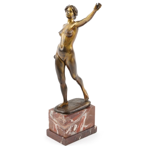  An Art Deco bronze figure of a standing female nude by Otto Scheer, raised on a rouge marble plinth ... 