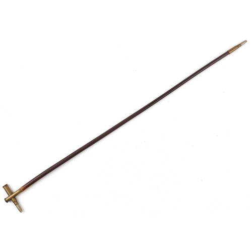 2483 - A military interest swagger stick with trench art shell case handle, 73cm in length.