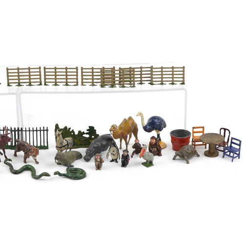 1258 - A collection of antique and later hand painted lead model farmyard animals and accessories including... 