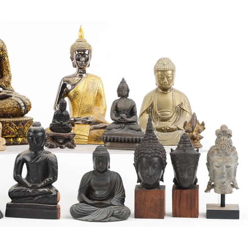 1478 - A collection of predominantly Tibetan figures of Buddha including carved stone, carved wood and lacq... 