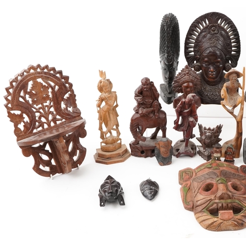 1471 - A large collection of Middle Eastern carved wood figures and wall masks including Malaysian busts, A... 