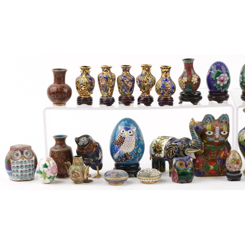 255 - A large collection of Chinese cloisonné vases, eggs, animals and trinkets, the largest 10.5cm high.