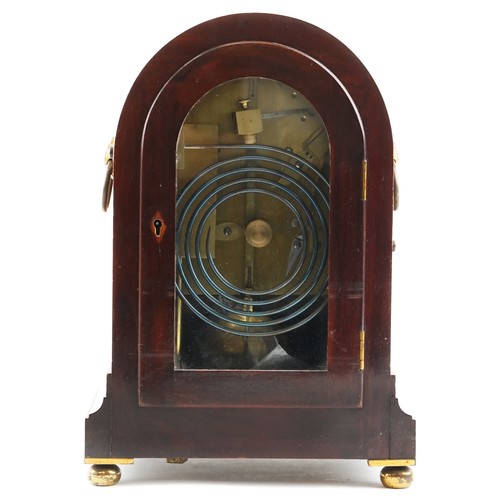  A 19th century figured mahogany mantle clock with eight day movement striking on a gong, the circula... 