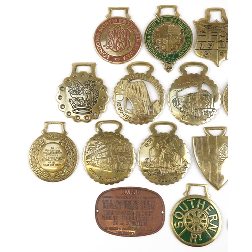 2330 - A group of sixteen various horse brasses together with two railway badges and a copper LMSR train pl... 