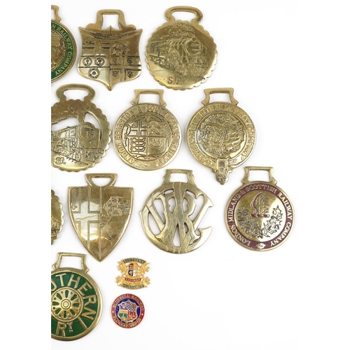 2330 - A group of sixteen various horse brasses together with two railway badges and a copper LMSR train pl... 